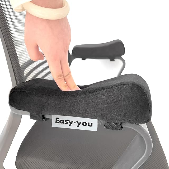 Pair of black slip-on armrest cushions on an office chair