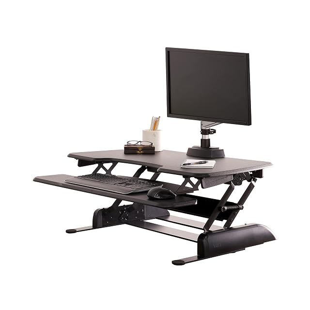 Vari VariDesk Essential 36 two-tier standing desk converter on a desk