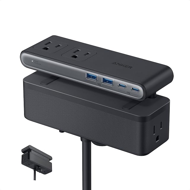 Anker Nano desk clamp power strip holding a laptop charging cable on a desk edge