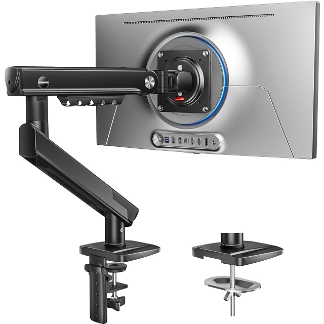 HUANUO gas-spring monitor arm mounted on a desk edge